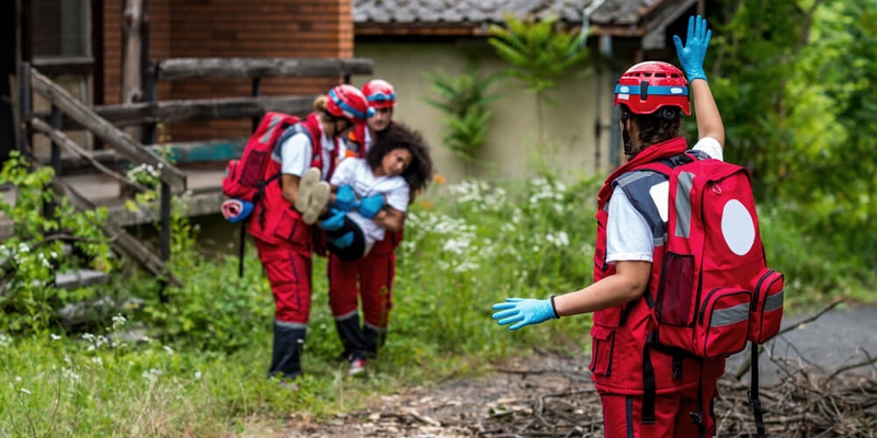 Rescue team evacuate female victim from house